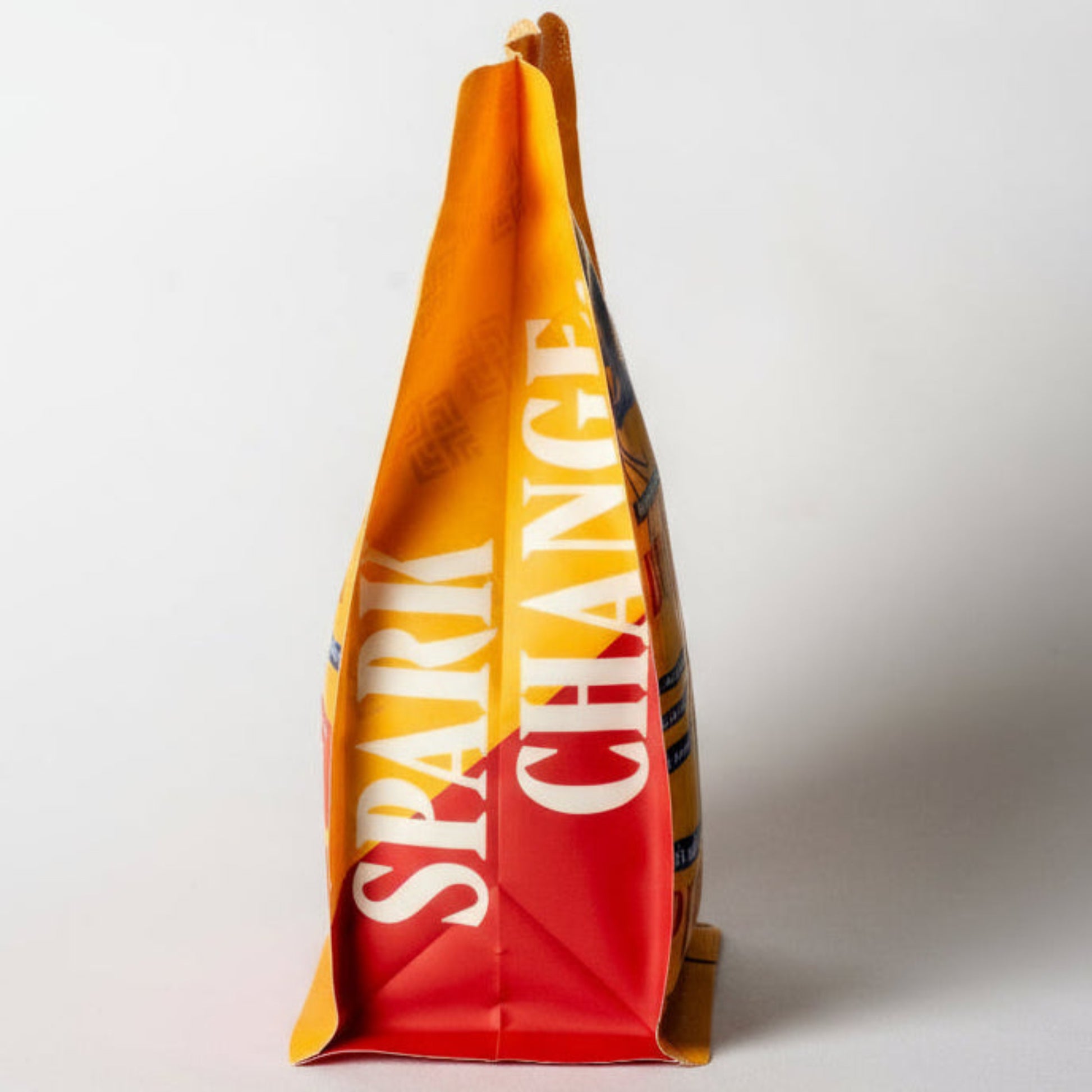 Light roast Kenyan coffee bag featuring Spark Change 